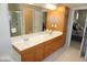 Spacious bathroom with a double vanity, storage cabinet and enclosed shower at 4810 Glenmist Ct, Raleigh, NC 27612