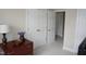 Bedroom with white walls, closet with gold knobs, and decorative accents at 4810 Glenmist Ct, Raleigh, NC 27612