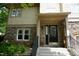 Charming home entrance with stone facade, front steps and attractive door at 4810 Glenmist Ct, Raleigh, NC 27612