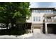 Inviting townhome exterior with stone accents, garage, and mature landscaping at 4810 Glenmist Ct, Raleigh, NC 27612