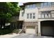 Beautiful exterior of a townhome with attached garage and outdoor balcony at 4810 Glenmist Ct, Raleigh, NC 27612