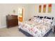 Bright main bedroom featuring neutral walls, floral bedding, and artwork above the bed at 4810 Glenmist Ct, Raleigh, NC 27612