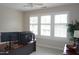 Well-lit office space features a curved desk, plantation shutters and views to the outside at 4810 Glenmist Ct, Raleigh, NC 27612