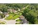 An aerial view of homes with mature trees and green lawns, offering a peaceful, residential setting at 517 Wheddon Cross Way, Wake Forest, NC 27587