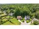 Aerial view of homes nestled among lush greenery, showcasing the neighborhood's serene setting at 517 Wheddon Cross Way, Wake Forest, NC 27587