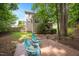Landscaped backyard featuring a wooden deck with seating and a view of the home's exterior at 517 Wheddon Cross Way, Wake Forest, NC 27587