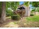 Exterior view of the back of the home with deck and steps to the yard at 517 Wheddon Cross Way, Wake Forest, NC 27587