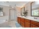 Well-appointed bathroom with double vanity, soaking tub, and neutral décor at 517 Wheddon Cross Way, Wake Forest, NC 27587