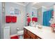 Whimsical ' bathroom with red and blue Dr. Seuss themed decor at 517 Wheddon Cross Way, Wake Forest, NC 27587