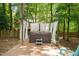 Backyard with a hot tub under a canopy with a small step stool on a wooden deck at 517 Wheddon Cross Way, Wake Forest, NC 27587