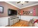 Media room area with flat screen TV and comfortable seating at 517 Wheddon Cross Way, Wake Forest, NC 27587