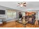 Open living space with hardwood floors connecting the dining and living area at 517 Wheddon Cross Way, Wake Forest, NC 27587
