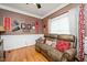 Cozy living area featuring comfortable seating and decorative movie-themed accents at 517 Wheddon Cross Way, Wake Forest, NC 27587