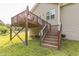A spacious wooden back deck with stairs offers room for outdoor dining and relaxation at 54 Lockwood Dr, Clayton, NC 27527
