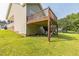 The back of the house has a large wooden deck with stairs leading to the yard at 54 Lockwood Dr, Clayton, NC 27527