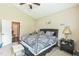 Main bedroom with a queen bed, nightstand, and attached en-suite at 54 Lockwood Dr, Clayton, NC 27527