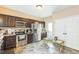 Kitchen featuring stainless steel appliances, dark wood cabinets, and durable flooring at 54 Lockwood Dr, Clayton, NC 27527