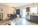 Eat-in kitchen features stainless steel appliances, tile flooring, and dark cabinets at 54 Lockwood Dr, Clayton, NC 27527