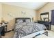 Primary bedroom featuring a large bed, neutral walls, vaulted ceiling, and dresser with mirror at 54 Lockwood Dr, Clayton, NC 27527