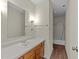 Bathroom featuring vanity and sink, mirror, towel bar and tiled shower at 5520 Kaplan Dr, Raleigh, NC 27606