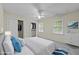 Comfortable bedroom featuring a queen bed, windows, and ceiling fan at 5520 Kaplan Dr, Raleigh, NC 27606