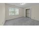 Cozy bedroom showcasing a window and closet space at 5520 Kaplan Dr, Raleigh, NC 27606