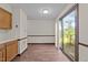 Well-lit dining area with sliding glass doors opening to an outdoor view at 5520 Kaplan Dr, Raleigh, NC 27606