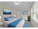 Comfortable bedroom featuring a queen bed, and bright natural light at 5520 Kaplan Dr, Raleigh, NC 27606