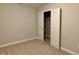 Bedroom featuring neutral walls, carpeting, and closet space at 656 Barneswyck Dr, Fuquay Varina, NC 27526