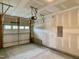 Spacious unfinished garage with an automatic door and electrical panel, ready for customization at 656 Barneswyck Dr, Fuquay Varina, NC 27526