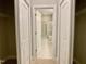 Hallway leading to an ensuite bathroom and walk-in closets at 656 Barneswyck Dr, Fuquay Varina, NC 27526