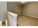 Upstairs loft area with neutral walls and plush carpeting at 656 Barneswyck Dr, Fuquay Varina, NC 27526