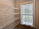 Walk-in pantry with adjustable wire shelving and a window for natural light at 656 Barneswyck Dr, Fuquay Varina, NC 27526