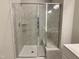 Modern walk-in shower with glass door and tiled bench in ensuite bathroom at 656 Barneswyck Dr, Fuquay Varina, NC 27526