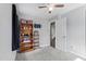 This bedroom features neutral walls, carpeting, closet and ceiling fan at 729 Carolina Dr, Dunn, NC 28334