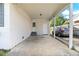 Attached carport with parking and doorway leading to backyard at 729 Carolina Dr, Dunn, NC 28334
