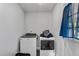 Bright laundry room featuring modern appliances and natural light at 729 Carolina Dr, Dunn, NC 28334