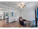 Open-concept living space with wood flooring and modern finishes at 729 Carolina Dr, Dunn, NC 28334