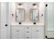 Bathroom featuring double vanity, quartz countertops, modern fixtures, and a glass-enclosed shower at 80 Birchtop Cir, Zebulon, NC 27597