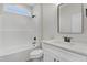 Well-lit bathroom features a shower-tub combination and a vanity with black hardware at 80 Birchtop Cir, Zebulon, NC 27597