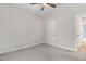 Bedroom featuring a ceiling fan, carpet, neutral paint, and a door that leads to other rooms at 80 Birchtop Cir, Zebulon, NC 27597