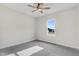 Bright bedroom with carpet flooring, ceiling fan, and a window that provides natural light at 80 Birchtop Cir, Zebulon, NC 27597