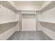 Walk-in closet with shelving to help keep organized and maintain a tidy wardrobe space at 80 Birchtop Cir, Zebulon, NC 27597