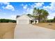 Beautifully designed one-story home with attached two-car garage and manicured front yard at 80 Birchtop Cir, Zebulon, NC 27597