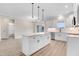 Eat-in kitchen boasts an island, modern appliances, and an open floor plan with seamless flow to the dining area at 80 Birchtop Cir, Zebulon, NC 27597