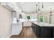 Modern kitchen with white cabinets, stainless steel appliances, and a large center island at 80 Birchtop Cir, Zebulon, NC 27597