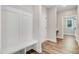 Inviting mudroom with built-in bench and coat rack, leading to the rest of the home at 80 Birchtop Cir, Zebulon, NC 27597