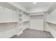 Spacious walk-in closet with built-in shelving and ample storage space for organization at 80 Birchtop Cir, Zebulon, NC 27597