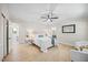 Relaxing bedroom featuring a comfortable bed, a ceiling fan, and warm natural light at 800 Camden Ave, Durham, NC 27701