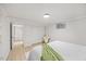 Bright bedroom features hardwood floors, a window, a closet, and soft, neutral decor at 800 Camden Ave, Durham, NC 27701